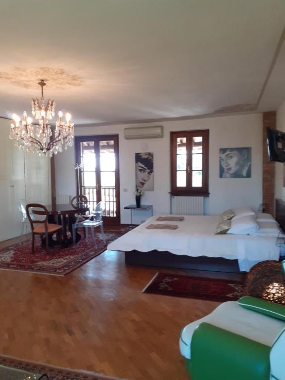 Postel nebo postele na pokoji v ubytování B&B Cascina in Franciacorta