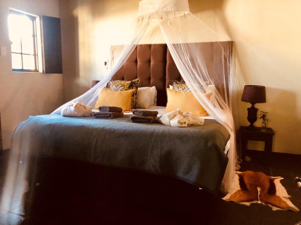 Postel nebo postele na pokoji v ubytování Addo African Home