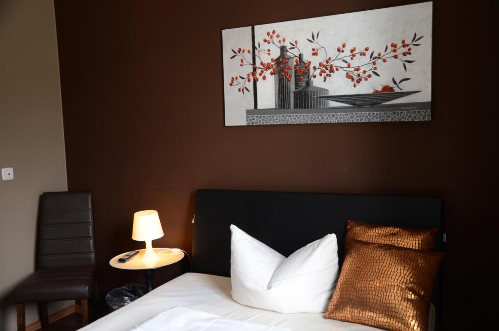 Postel nebo postele na pokoji v ubytování Hotel Rheinstein