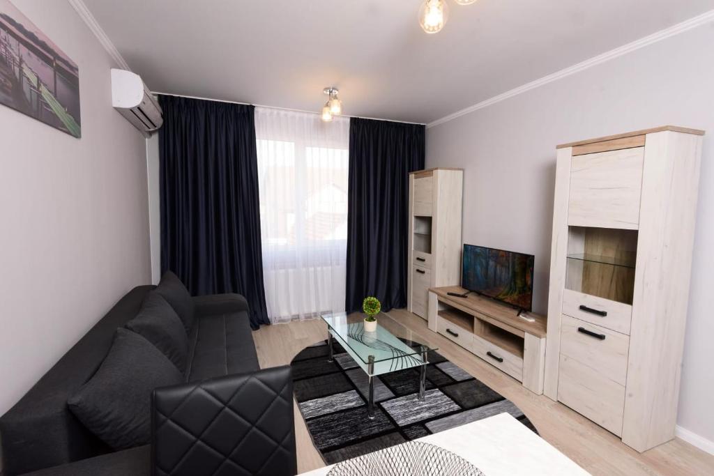 TV a/nebo společenská místnost v ubytování Povi Residence