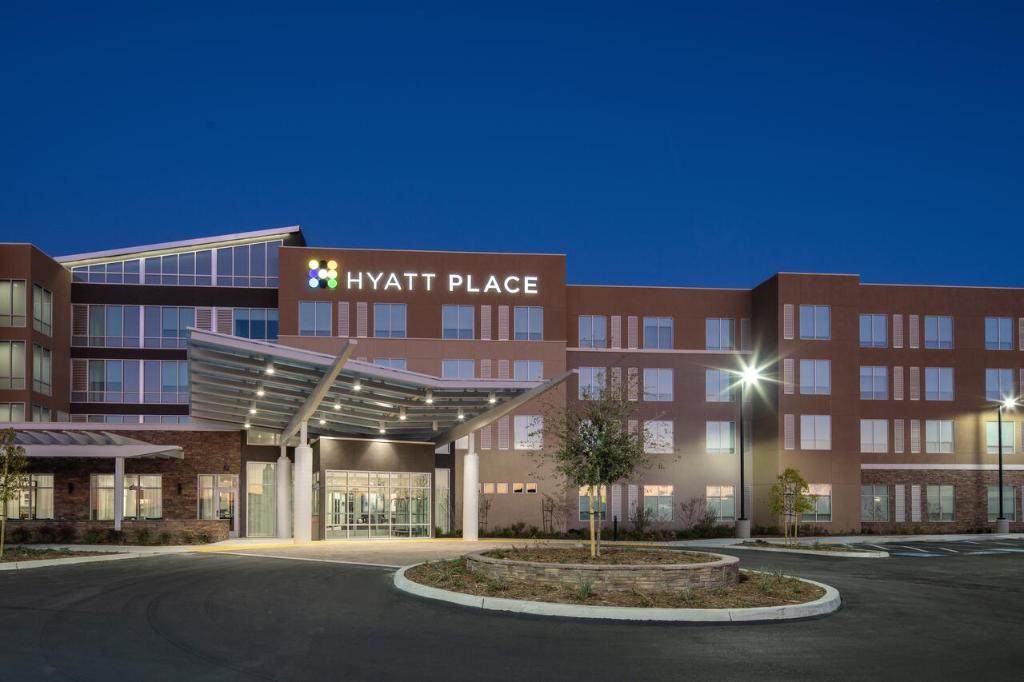 a large building with a night place sign on it at Hyatt Place Bakersfield in Bakersfield