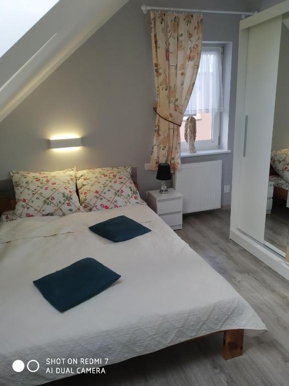 Postel nebo postele na pokoji v ubytování Apartamenty u" Lusi"