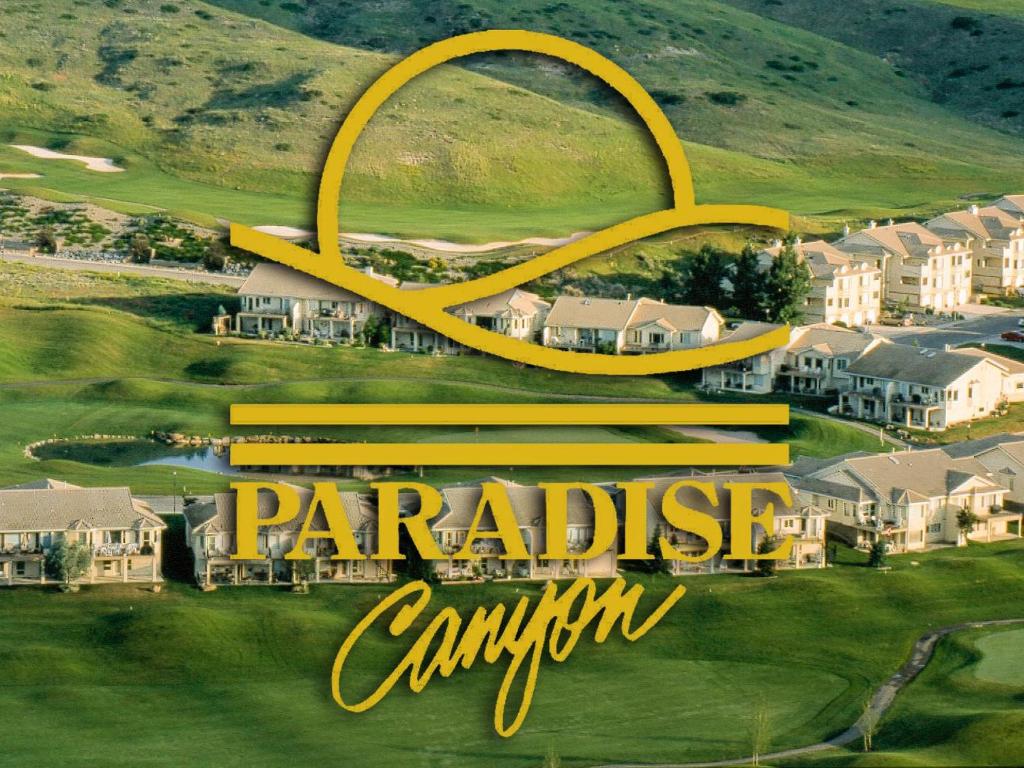 a poster for a resort with the symbol of the parapeake canyon at Paradise Canyon Golf Resort, Luxury Condo U407 in Lethbridge