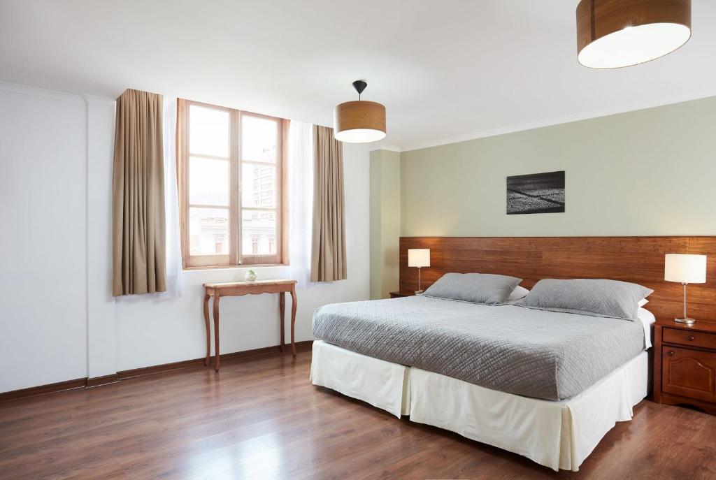 Postel nebo postele na pokoji v ubytování Hotel Loreto