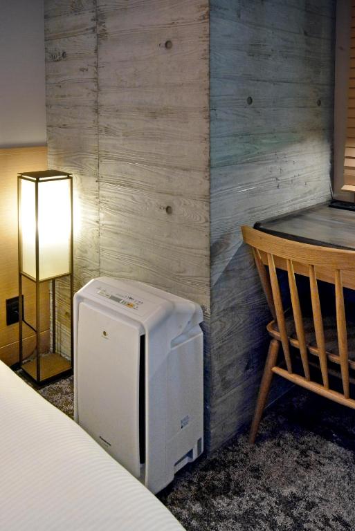 Postel nebo postele na pokoji v ubytování HOTEL HILLARYS Akasaka