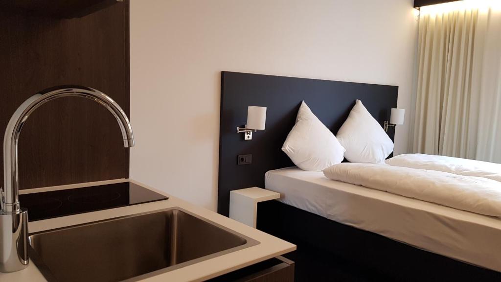 Postel nebo postele na pokoji v ubytování OY Hotel by WMM Hotels