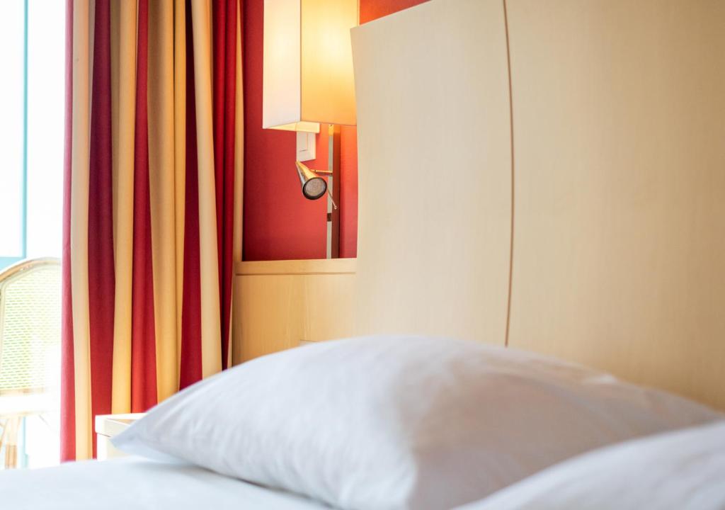 Voodi või voodid majutusasutuse Grand Hotel et Centre Thermal d'Yverdon-les-Bains toas