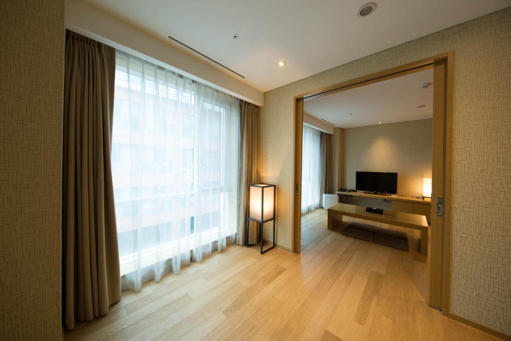 Postel nebo postele na pokoji v ubytování Solaria Nishitetsu Hotel Busan