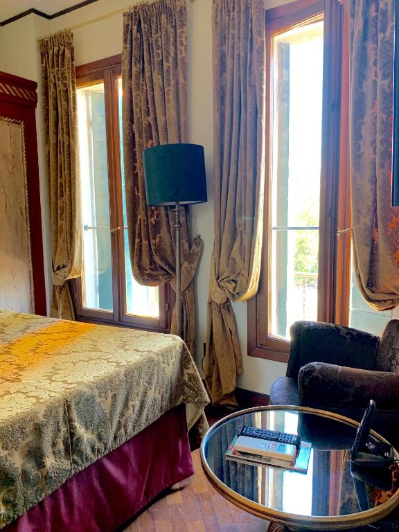 Postel nebo postele na pokoji v ubytování Hotel La Calcina