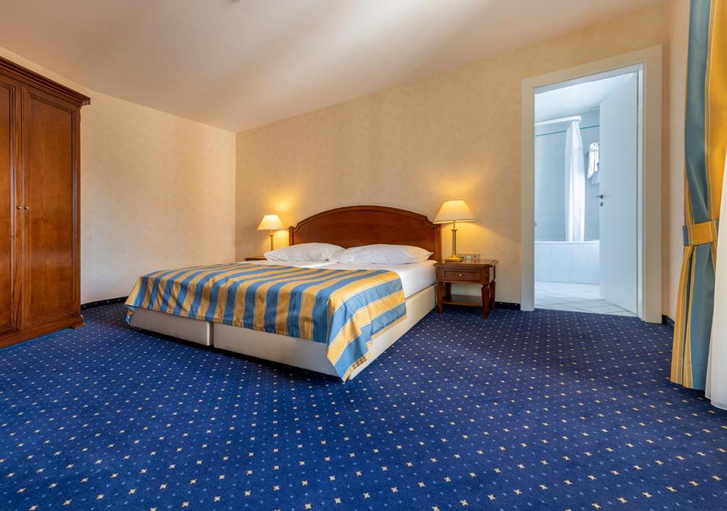 Voodi või voodid majutusasutuse Grand Hotel et Centre Thermal d'Yverdon-les-Bains toas