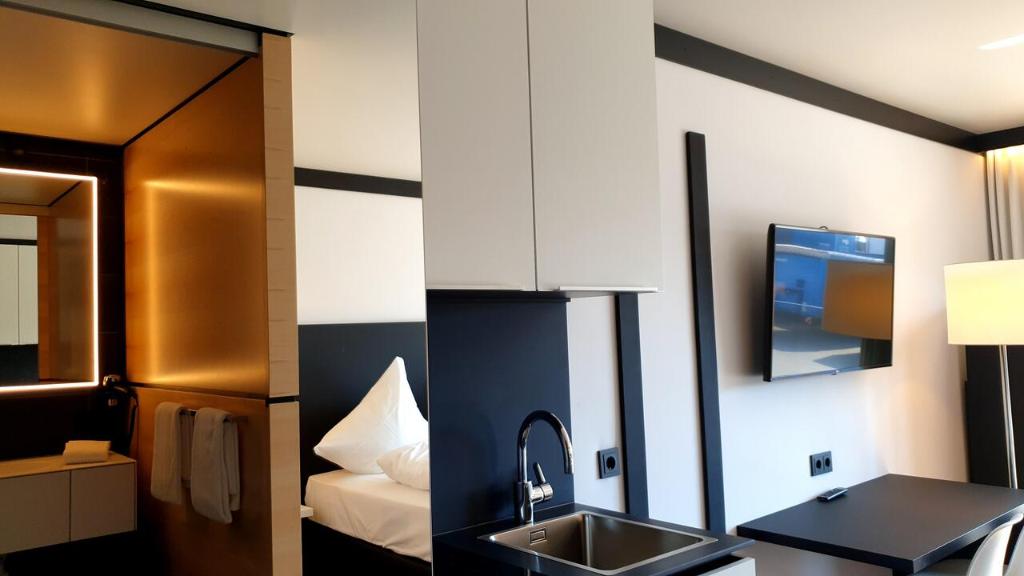 TV a/nebo společenská místnost v ubytování ILL Hotel by WMM Hotels