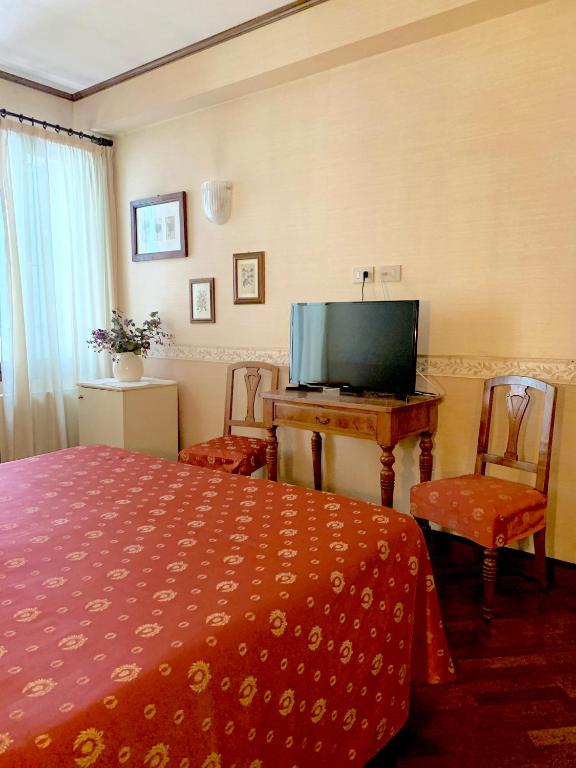 TV a/nebo společenská místnost v ubytování Hotel La Calcina