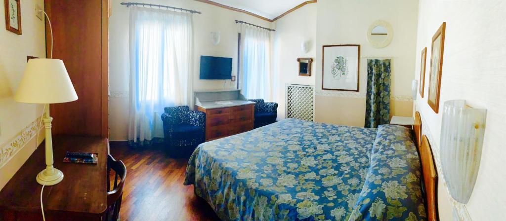 Postel nebo postele na pokoji v ubytování Hotel La Calcina