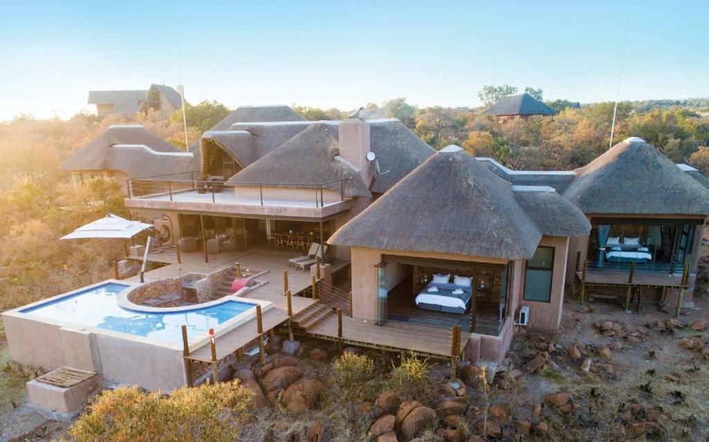 an aerial view of a house with a pool at Shammah lodge Mabalingwe Nature Reserve in Mabula