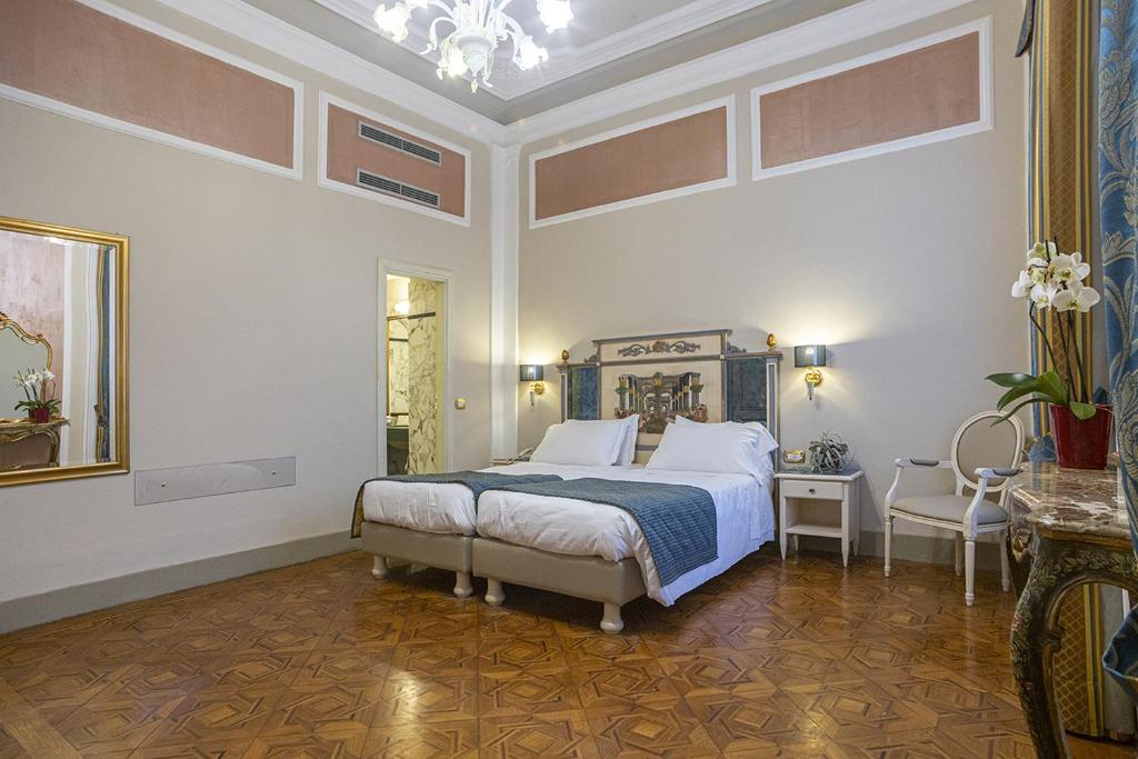 Postel nebo postele na pokoji v ubytování Hotel Donatello