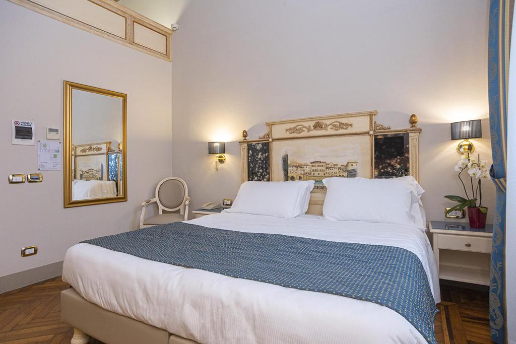Postel nebo postele na pokoji v ubytování Hotel Donatello