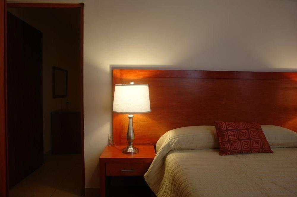 Postel nebo postele na pokoji v ubytování Hotel Marllou
