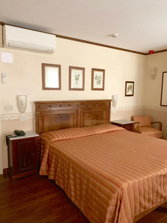 Postel nebo postele na pokoji v ubytování Hotel La Calcina