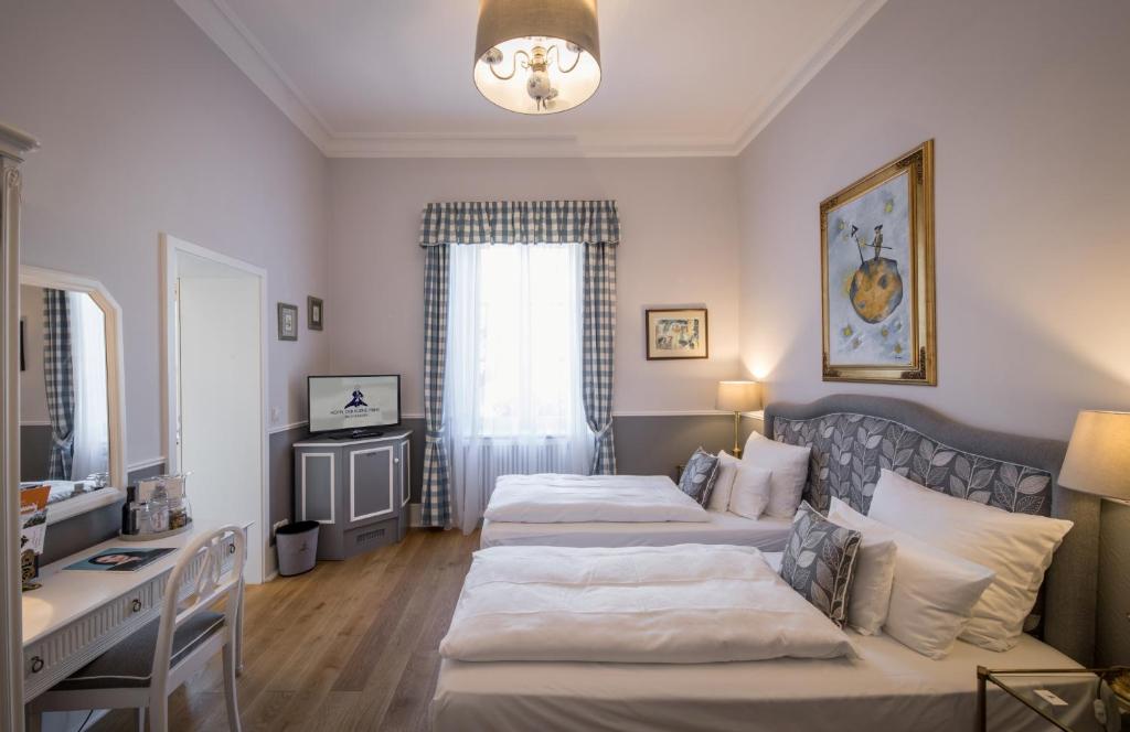 Postel nebo postele na pokoji v ubytování Hotel Der Kleine Prinz