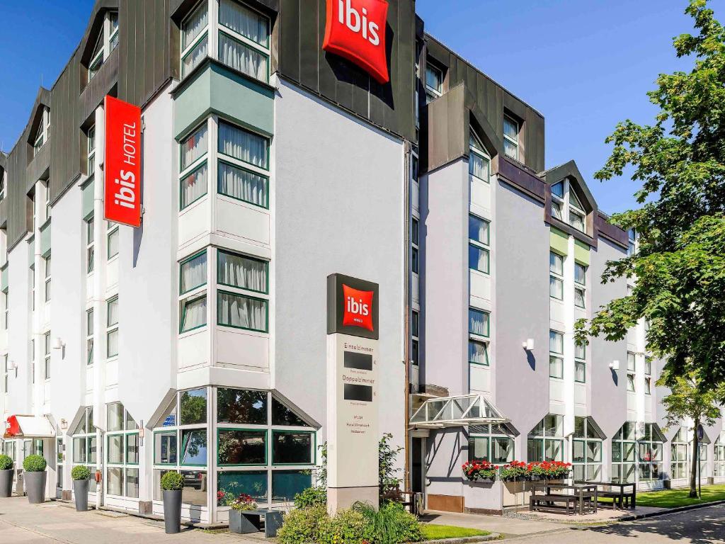 a hotel building with aldos signs on the side of it at ibis München City Nord in Munich