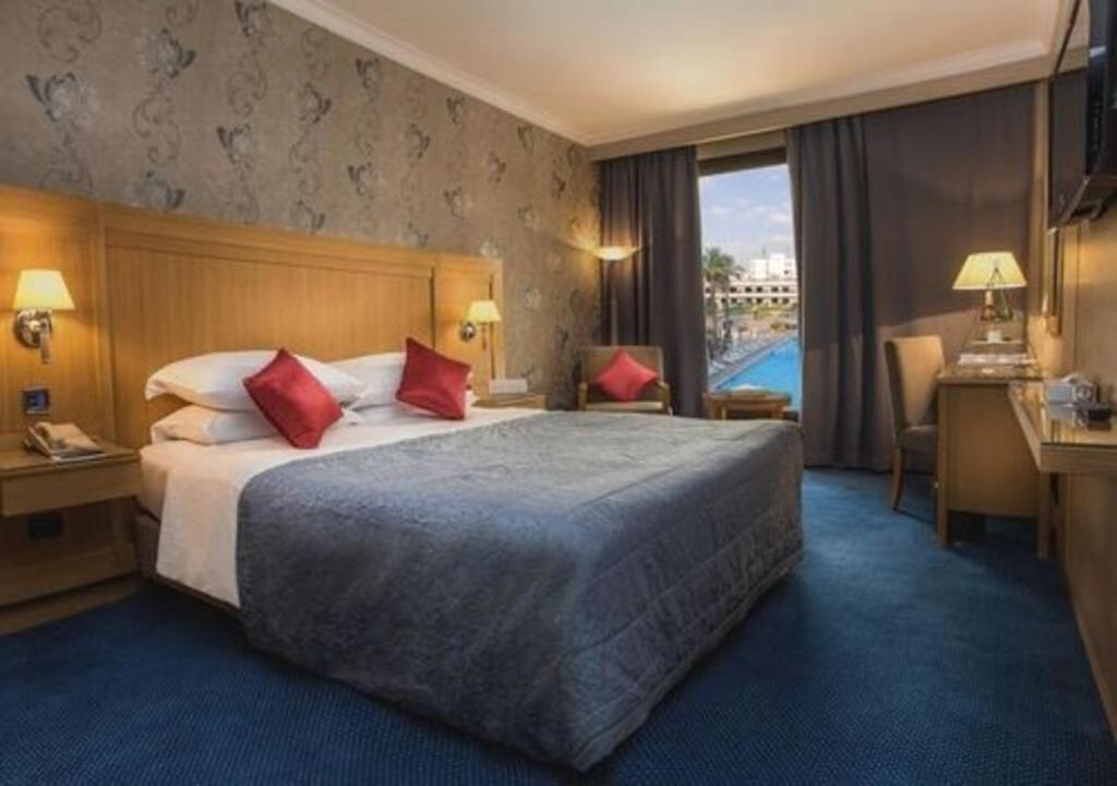 Postel nebo postele na pokoji v ubytování Le Passage Cairo Hotel & Casino