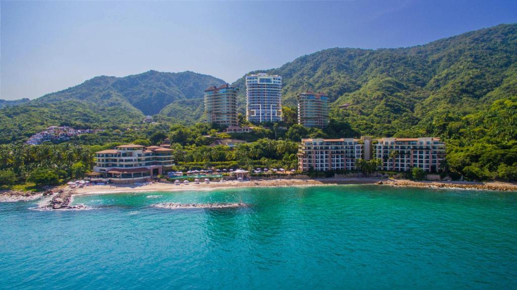 a large body of water with several boats in it at Garza Blanca Preserve Resort & Spa in Puerto Vallarta