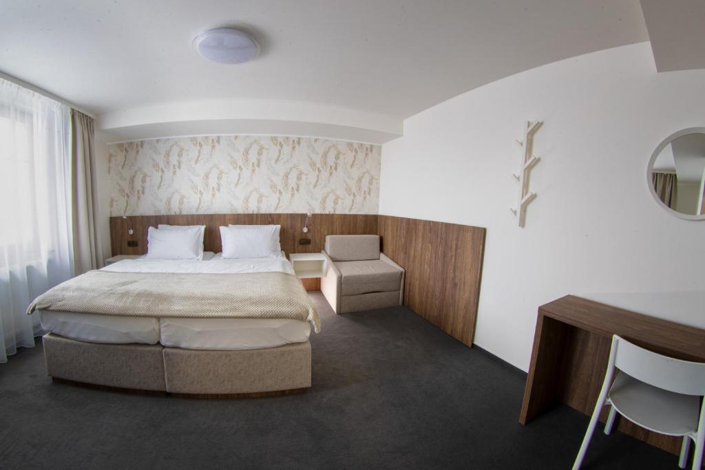 Postel nebo postele na pokoji v ubytování Hotel Prichovice