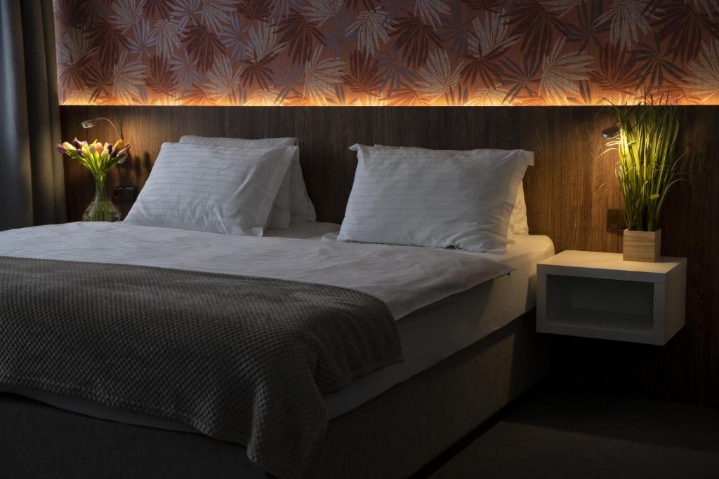 Postel nebo postele na pokoji v ubytování Hotel Prichovice