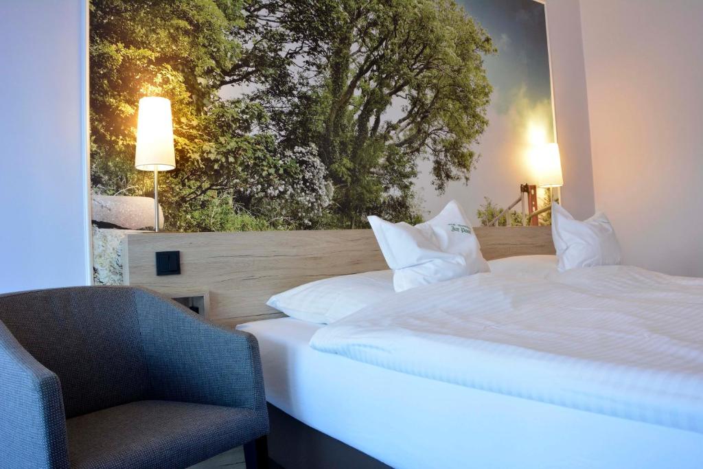 En eller flere senge i et værelse på Hotel Restaurant "Zur Post"