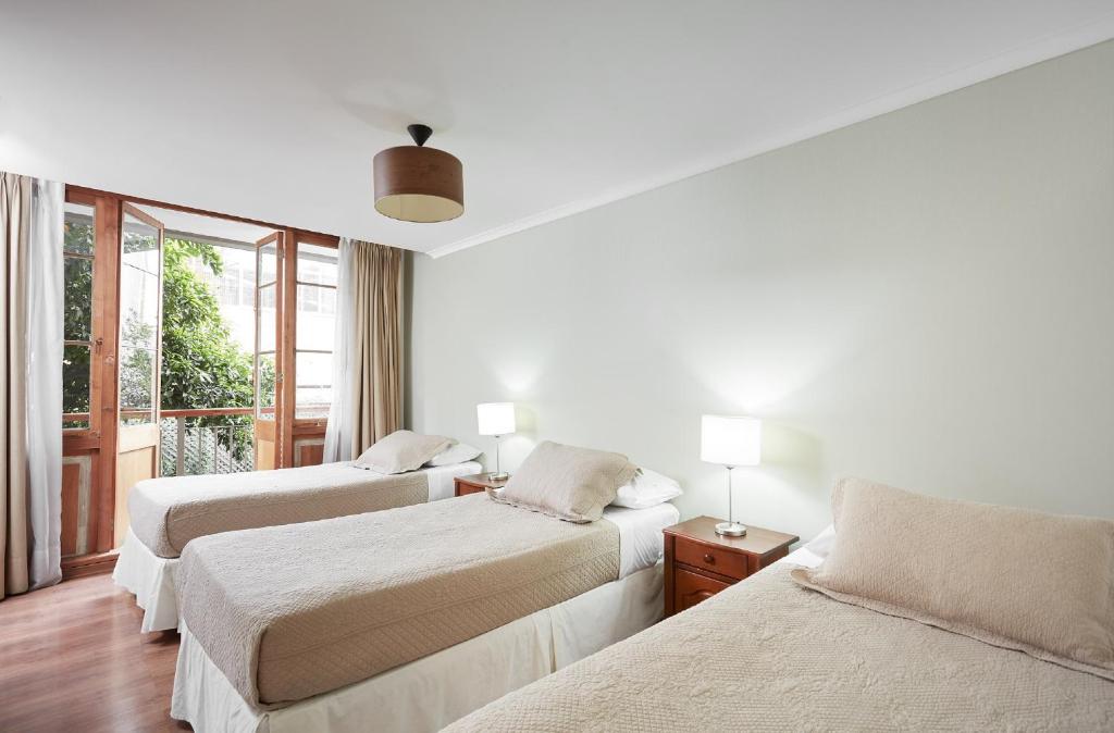 Postel nebo postele na pokoji v ubytování Hotel Loreto