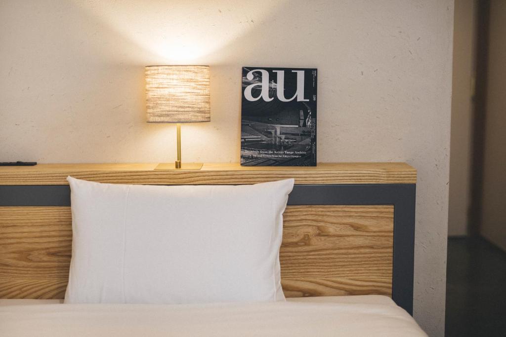 Postel nebo postele na pokoji v ubytování Hotel Noum OSAKA
