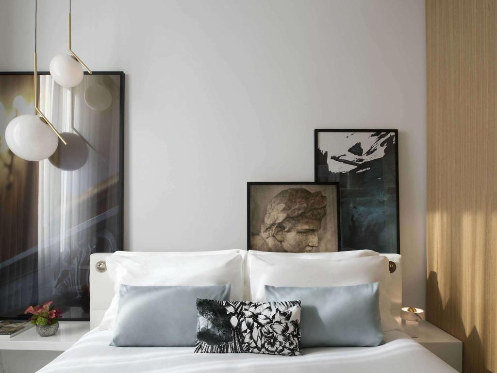 Postel nebo postele na pokoji v ubytování Sofitel Roma Villa Borghese