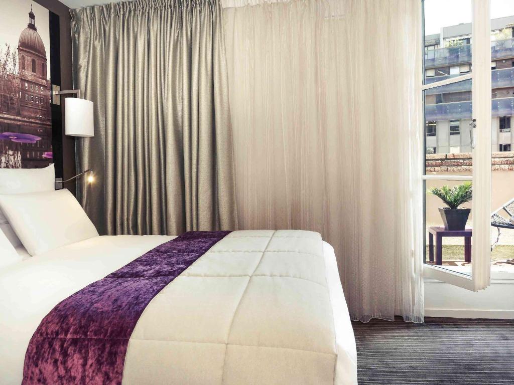 Postel nebo postele na pokoji v ubytování Mercure Toulouse Centre Wilson Capitole