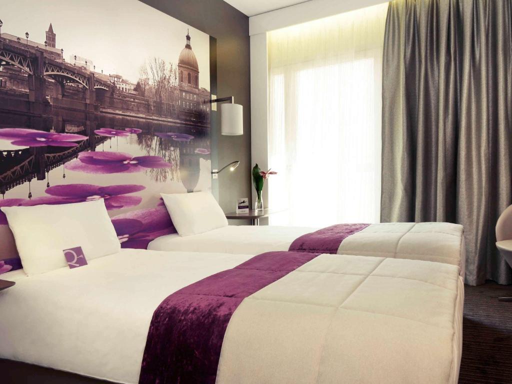 Postel nebo postele na pokoji v ubytování Mercure Toulouse Centre Wilson Capitole