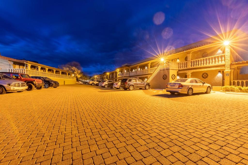 a parking lot with cars parked in front of a building at Cedars Resort in Sedona