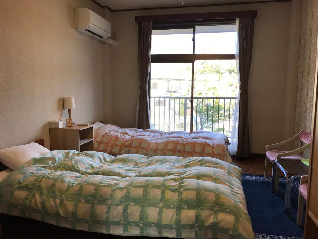 Postel nebo postele na pokoji v ubytování Guesthouse E-ne