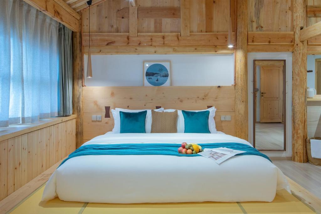 Postel nebo postele na pokoji v ubytování SuShe Inn（2nd Jianshe Inn)
