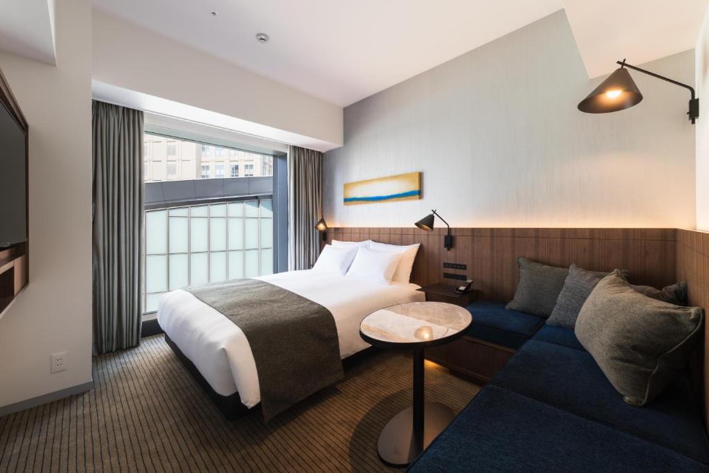 Postel nebo postele na pokoji v ubytování Hotel Metropolitan Kawasaki