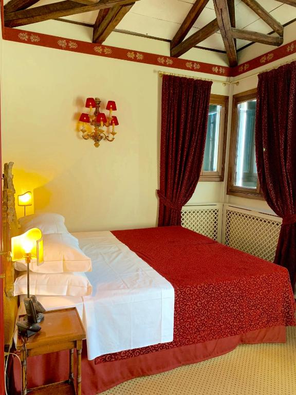Postel nebo postele na pokoji v ubytování Hotel La Calcina