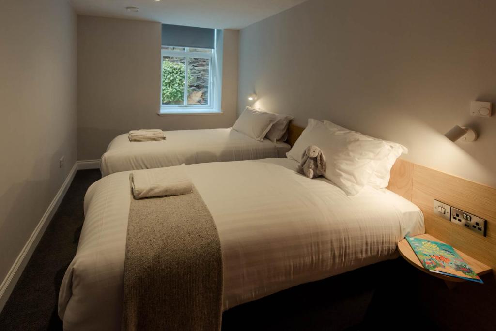Postel nebo postele na pokoji v ubytování Hotel Isaacs Cork City