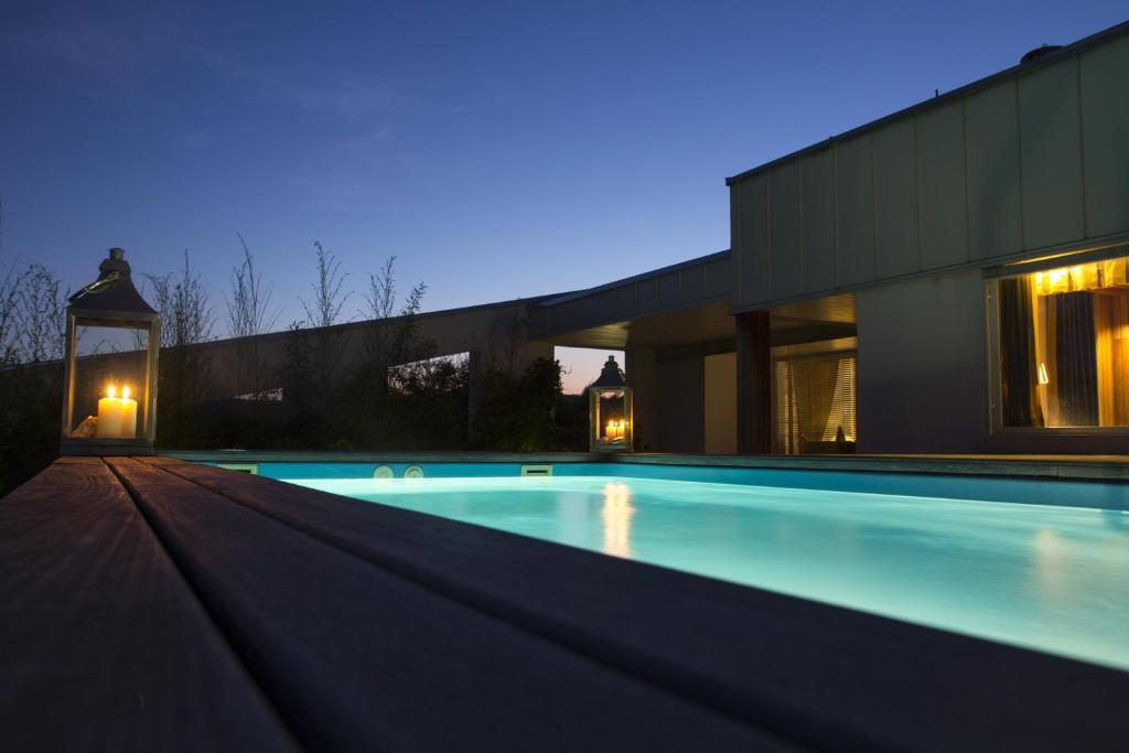 a swimming pool in front of a house at Pavi Apts Ljubljana - Private Rooftop Swimming pool in Ljubljana