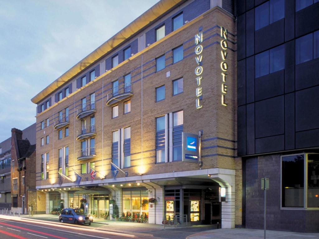 a large building with a clock on the front of it at Novotel London Waterloo in London