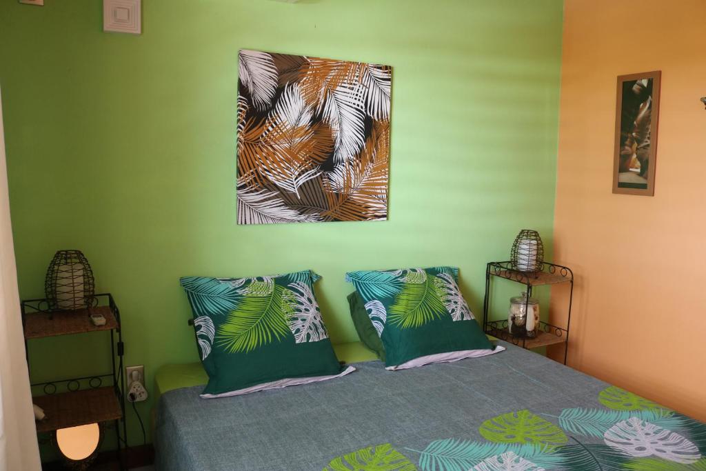 Postel nebo postele na pokoji v ubytování Villa Rosa Karibella