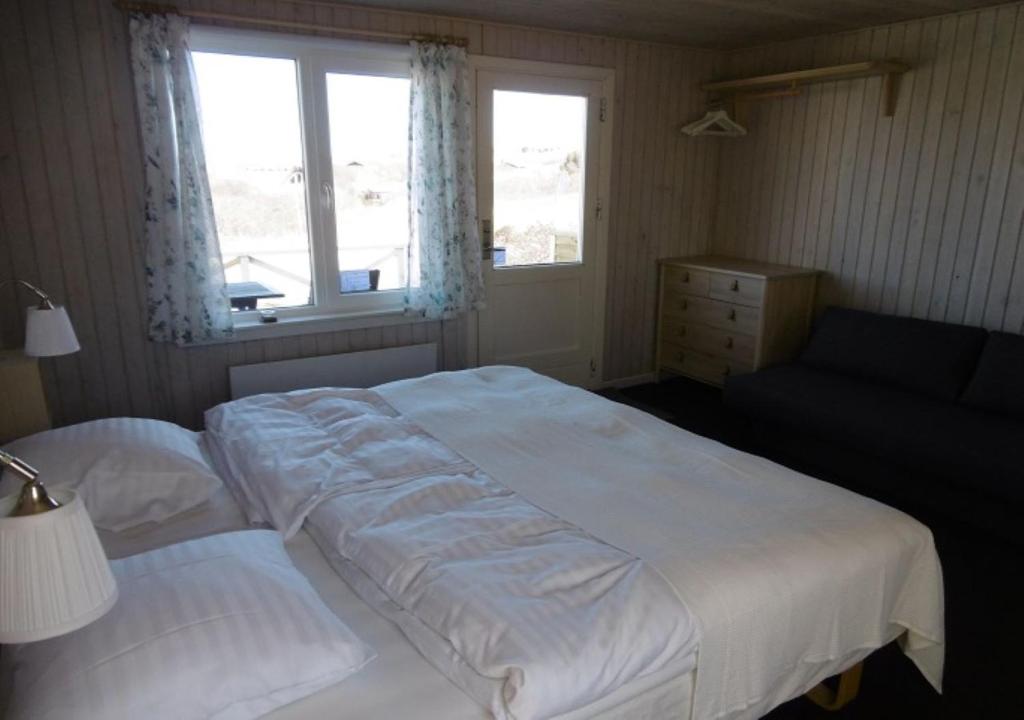 Postel nebo postele na pokoji v ubytování Munchs Badehotel