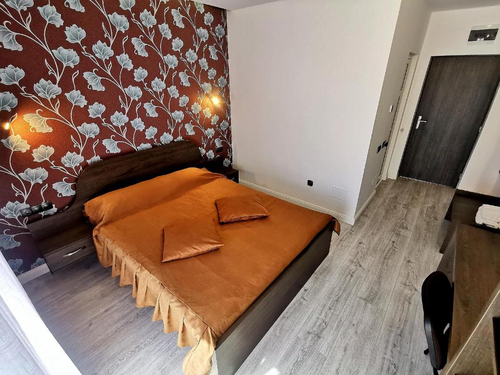 Postel nebo postele na pokoji v ubytování Pensiunea Gaby