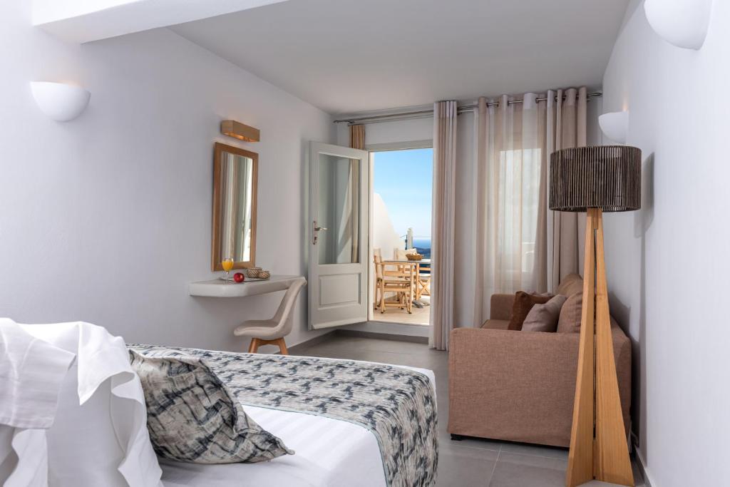A bed or beds in a room at Adamant Suites