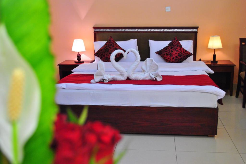 Postel nebo postele na pokoji v ubytování Al Qidra Hotel & Suites Aqaba
