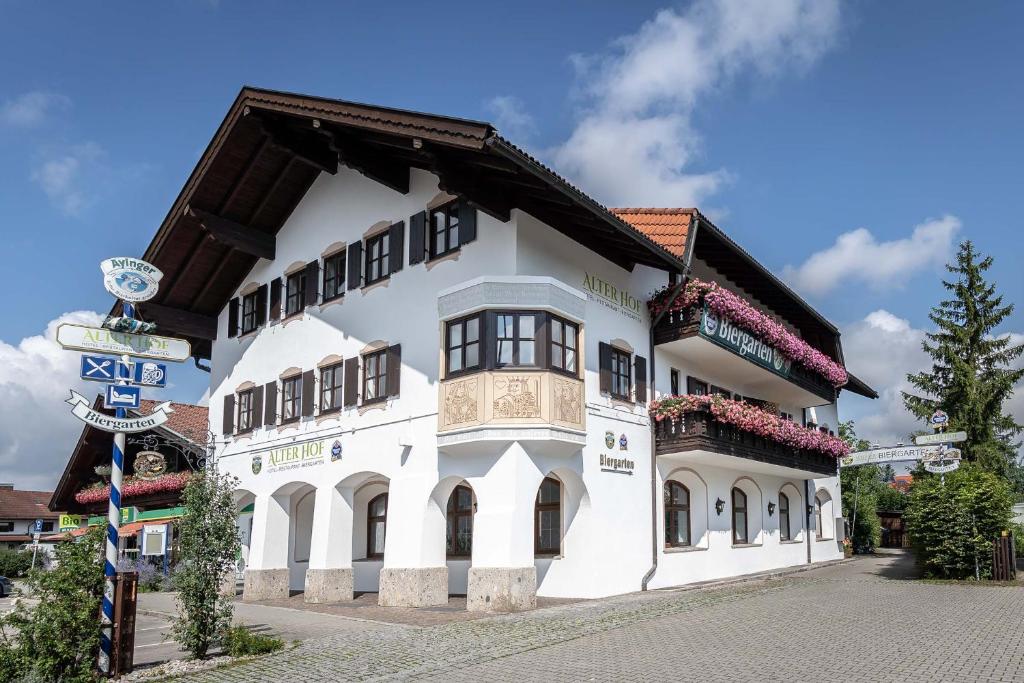 a large white building with a brown roof at Alter Hof in Vaterstetten