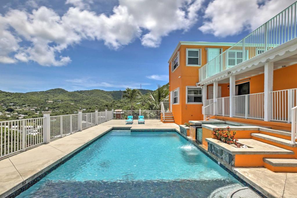 a swimming pool on the balcony of a house at Breezy St Croix Bungalow with Pool and Ocean Views! in Christiansted