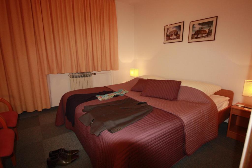 Postel nebo postele na pokoji v ubytování Vila Romana